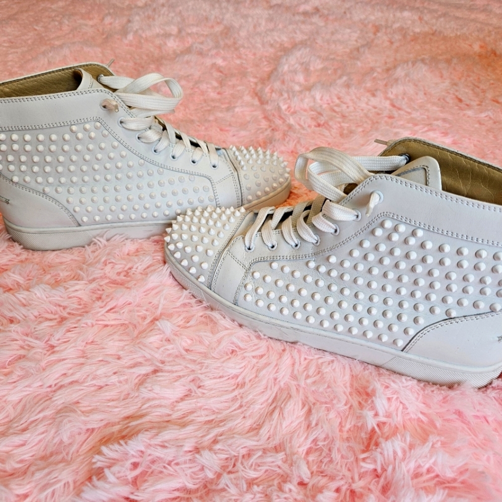 White on White mid-top Christian Louboutin spiked sneakers